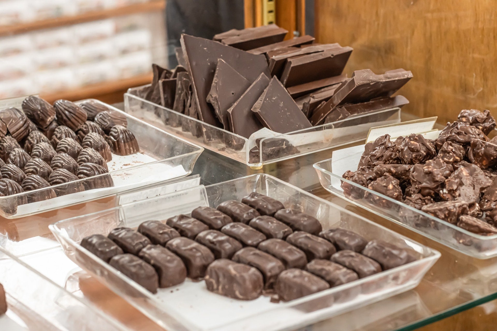 Milk and Dark Cashew Bark sitting in a tray in a case at Hansel and Gretel Candy Kicthen, Helen Georgia