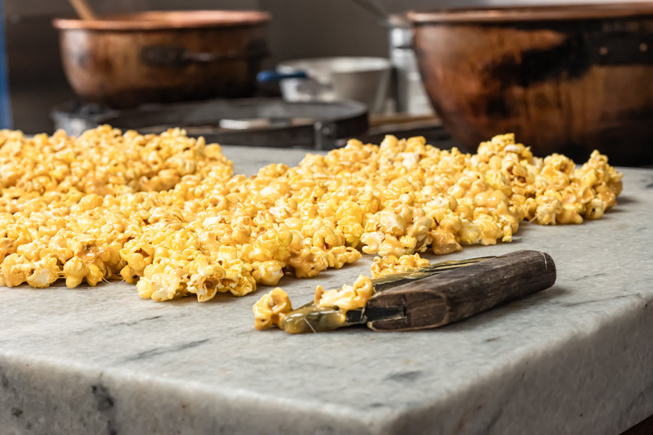 Caramel Corn cooling on a marble table top at Hansel and Gretel Candy Kitchen Helen Georgia