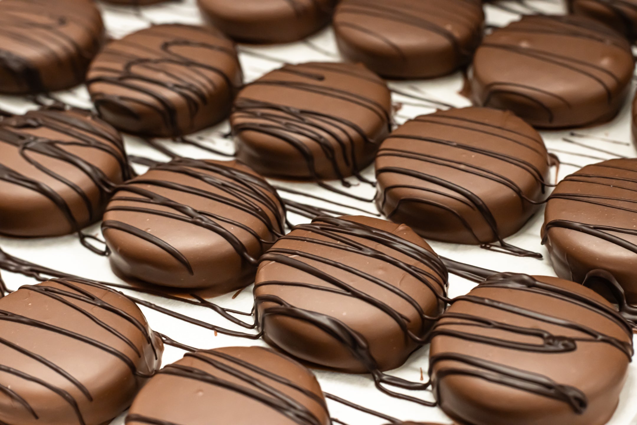 Chocolate Covered Oreos on a cooling tray 