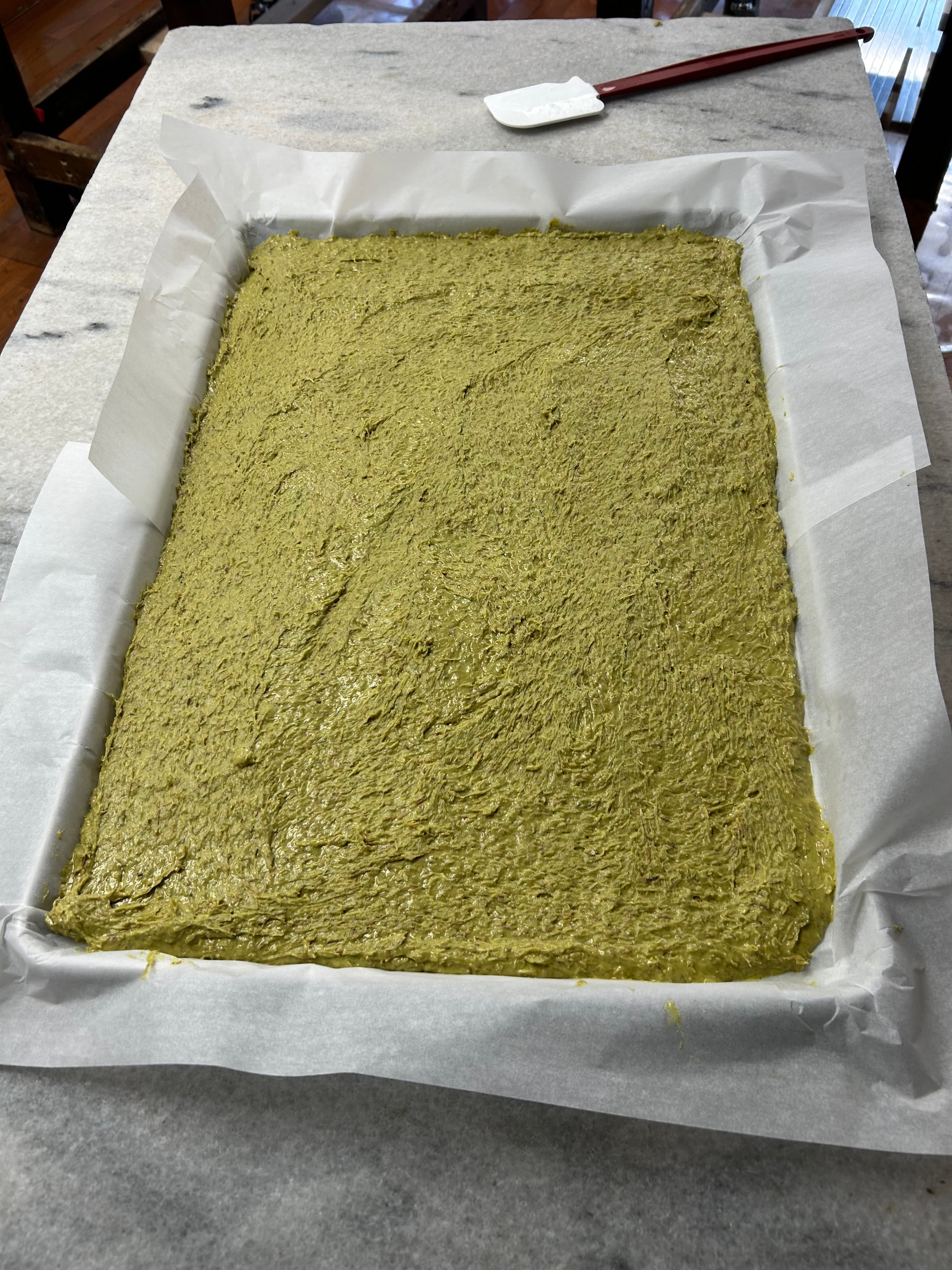 pistachio filling after being filled in a tray and cooled
