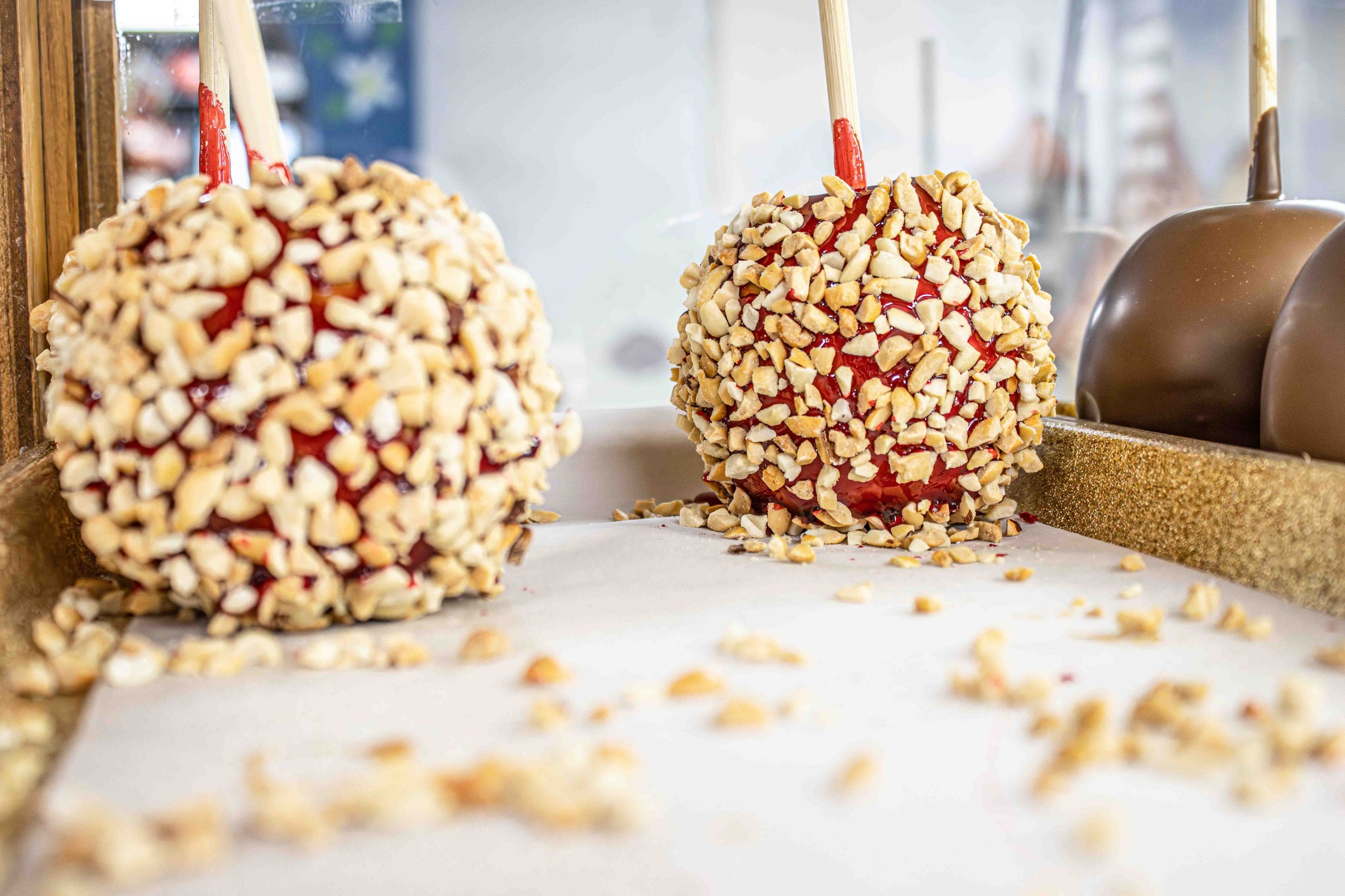 Handmade Candy Apple with Peanuts (Instore Pick-up Only) at Hasnel and Gretel Candy Kitchen Helen GA