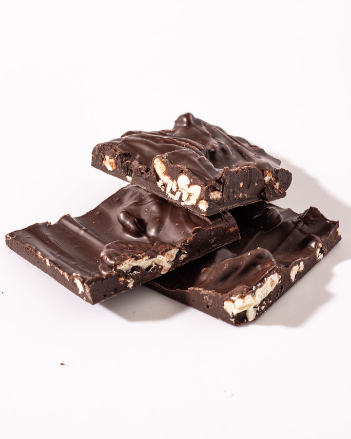 Hansel and Gretel Pecan Chocolate Bark pieces stacked up from Hansel and Gretel Candy Kitchen Helen Georgia