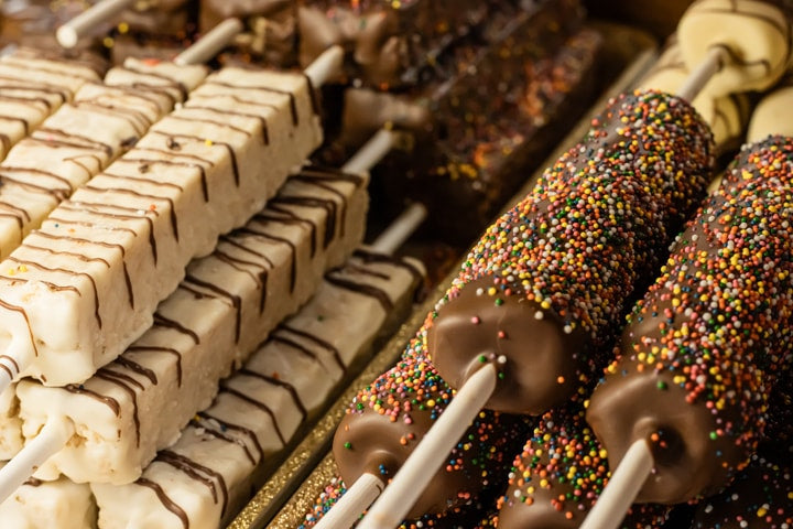 Chocolate Covered Marshmallow on a stick with rainbow sprinkles